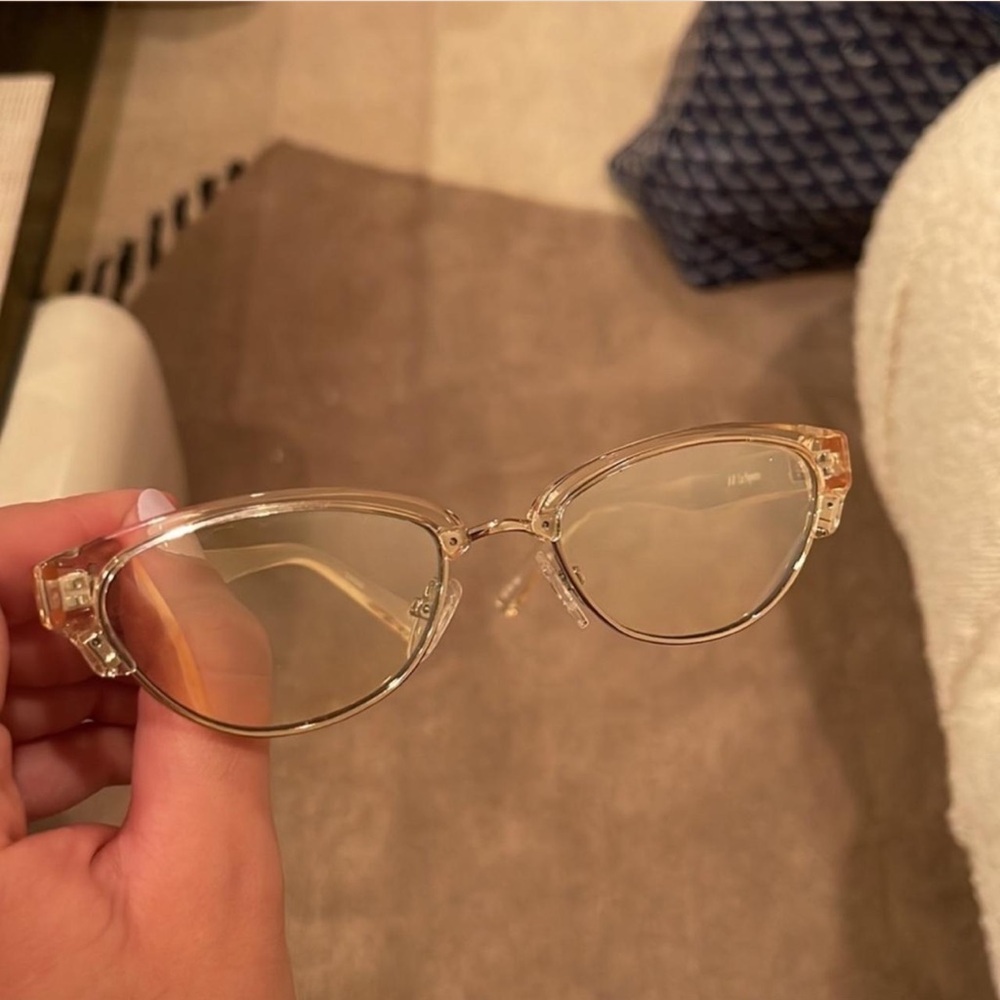 Le Specs translucent champagne sunglasses.